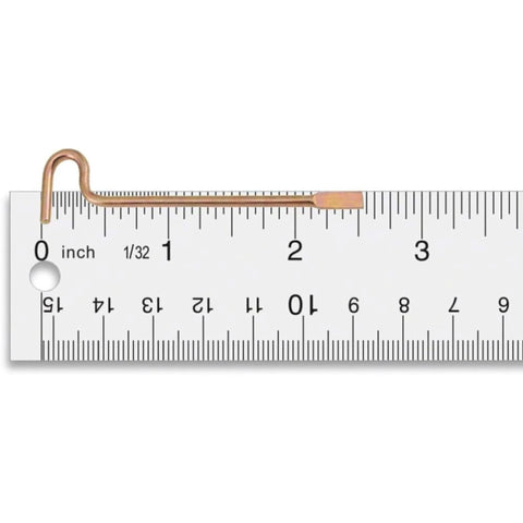 Close-up of a gold finish emergency pin on a ruler, part of a Gold Finish Ten Pack Emergency Pins For Kwikset Privacy Bedroom And Bathroom Door Levers And Knobs Compatible With Kwikset Interior Privacy Doors With Small Center Access Hole Durable Steel Release Tools For Quick Access And Safe Unlocking Ten Pack.