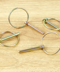 4 Pack Heavy Duty Stainless Steel Gold Lynch Pins With Ring For Trucks Tractors Trolleys Lawn Mowers And Trailers One Quarter Inch By One And Three Quarter Inch Zinc Coated Six Millimeter By Forty Five Millimeter Corrosion Resistant on wood surface