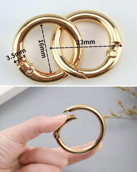 50 Pack 1 Inch Metal Spring O Rings Set with Round Carabiner Clips Snap Hooks in Gold Finish, shown in close-up and handheld.
