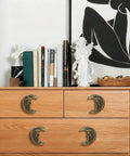 Gold Finish Cast Iron Crescent Moon Cabinet Knobs Set Of 6 for Vintage Gothic Furniture on wooden dresser
