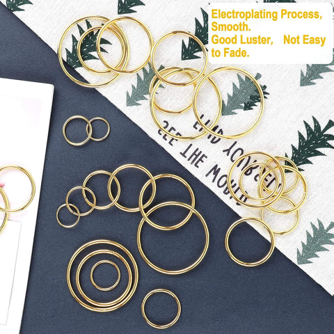 Gold Metal O Rings Set 60 Pcs In 6 Sizes Multi Purpose Buckle Loop Rings For Hardware Bags DIY Keychains Belts Craft Projects 15mm 20mm 25mm 32mm 38mm 50mm displayed on fabric surface