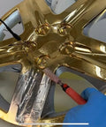 Chrome Plating Kit With Brush System 24K Gold Solution Three Step Process applied to car wheel rim in workshop using plating machine.