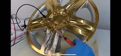 Chrome Plating Kit With Brush System 24K Gold Solution Three Step Process applied to car wheel rim in workshop using plating machine.