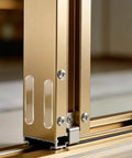 Close-up view of a metal sliding door track and edge.