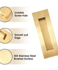 Close-up of gold 7-inch recessed finger flush pulls for pocket doors, highlighting invisible screw hole, smooth edge, and brushed surface.