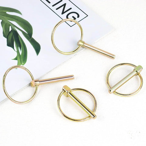 4 Pack Heavy Duty Stainless Steel Gold Lynch Pins With Ring For Trucks Tractors Trolleys Lawn Mowers And Trailers One Quarter Inch By One And Three Quarter Inch Zinc Coated Six Millimeter By Forty Five Millimeter Corrosion Resistant displayed on a white surface