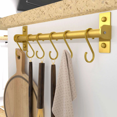 Gold Kitchen Utensil Holder Hanger with 8 Hooks, Wall Mounted Pot and Pan Rack holding cooking utensils and towel