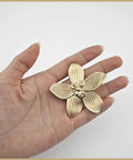 Hand holding Six Pack 2.4 Inch Gold Flower Cabinet Knob for Dresser and Drawer Furniture Hardware Vintage Floral Petal Pulls