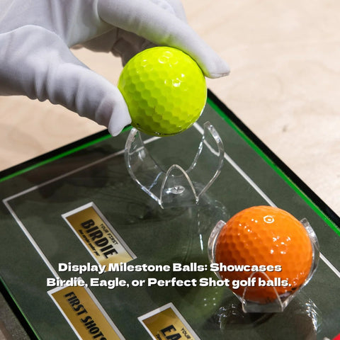 Golf Ball Wall Mount Display For Single Balls With Transparent Acrylic Claw Design and milestone card shown with two golf balls