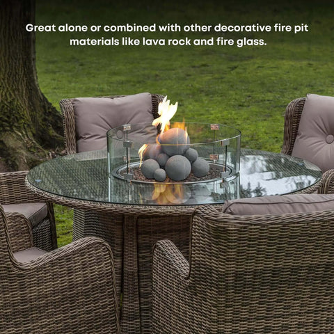 12 Pack Gray Ceramic Balls, Mixed 4 Sizes Fireplace Balls on glass-top table with fire pit, outdoor setup