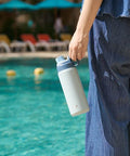 Person holding Insulated Stainless Steel Water Bottle With Spout Lid And Easy Grip Handle For Sports On The Go Vacuum Insulated Bottle