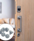 50 Pcs Rubber Door Silencers For Metal Door Frames Half Inch Diameter Anti Collision Silencers Prevent Door Slams Quiet Hinge Outlet Wear Resistant Non Slip Gray installed on wooden door with insert showing multiple silencers.