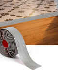 Floor Transition Strip for Doorways, 2'' x10Ft Self-Adhesive Laminate Floor Strip, shown in gray wood grain, bridging floor gap