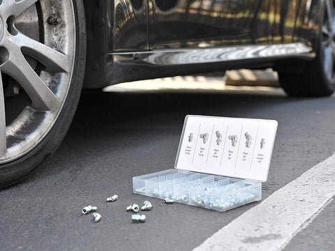 Grease Fitting Assortment Kit For Angled And Straight Zerks, 110 Pieces SAE A3 Steel Fittings displayed near a car on pavement