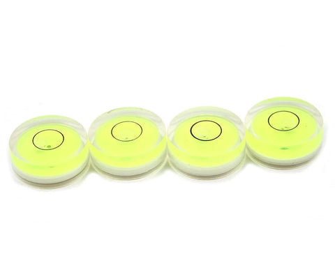 Four compact green round mini spirit levels with clear acrylic housings deliver precise bubble readings for tiny projects.