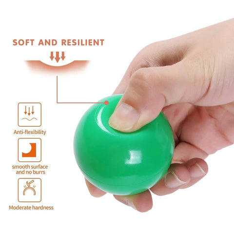 Hand squeezing green ball from Green Ball Pit Balls - Crush Proof Plastic Balls for Ball Pit Pack of 100pcs Set for Toddlers Ball Pool Playtent Tunnels with Reusable Storage Bag - 2.16 Inch (White+Green)