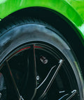 Close-up of tire with Five Pack Tire Valve Stem Cap Covers With Metal Shell And Plastic Liner Anti Corrosion Leak Proof American Flag Design