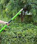 Person holding Insulated High Voltage Rescue Hook With Non Conductive Handle 2m Hot Stick Rescue Tool For Electric Shock Emergencies Heavy Duty U Shaped Hook In Green Ideal For Power Stations Factories Auto Repair And Field Work outdoors.