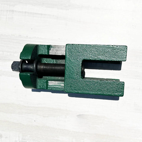 Beefy Heavy Duty Machine Leveling Pad with wedge design, green cast-iron, for industrial equipment stability, close-up view