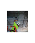 Worker using 360° self-leveling green laser to install ceiling fixtures with cordless 12V power, up to 100 ft range, and IP65 protection.