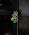 Set Of 2 Metal Green Leaf Cabinet Pulls And Drawer Handles With Simulated Leaf Shape Gradient Color And Glossy Finish installed on a cabinet