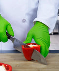 Person wearing Green Nitrile Latex Free Gloves 8 Mil Heavy Duty Raised Diamond Texture Box 100 slicing red pepper
