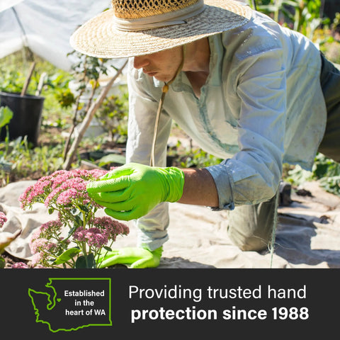 Gardener wearing Green Nitrile Latex Free Gloves 8 Mil Heavy Duty Raised Diamond Texture, picking pink flowers outdoors.