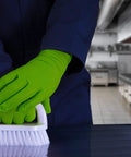 Person wearing Green Nitrile Latex Free Gloves 8 Mil Heavy Duty Raised Diamond Texture Box 100 cleaning with brush in kitchen
