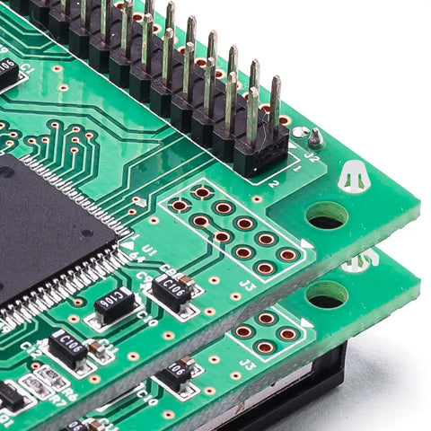 Close-up of green circuit boards with electronic components, representative of use with 100 Pack Nylon PCB Standoffs With Reverse Locking Snap In Design, Non Conductive Spacers For DIY Electronics, Arcade And Control Modules, Easy Tool Free Installation, 1.16 Inch Height.