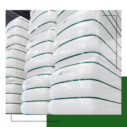 Heavy Duty PET Strapping Coil Five Eighths Inch Wide 0.035 Inch Thick, 200 Feet, 1400 Lbs Break Strength in use on white pallets.
