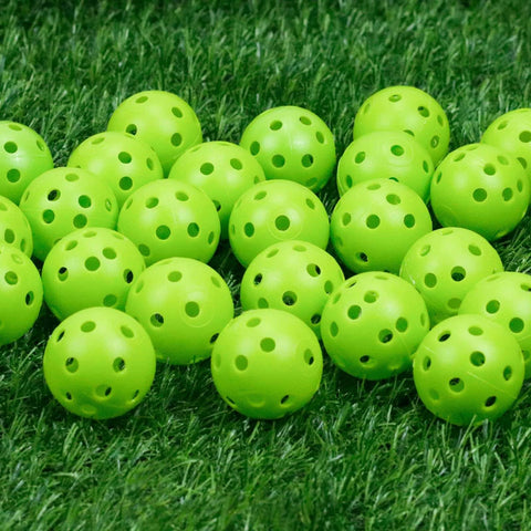 50 Pack Plastic Golf Balls Practice Limited Flight Golf Training Ball Hollow Swing Practice Indoor Balls (Green) on grass