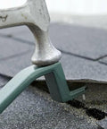 Roof Snake RS501 Shingle Pry Bar for nail removal and damaged shingle replacement shown during use on roof with hammer.