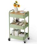 Three Tier Rolling Cart With Table Top Heavy Duty Metal Utility Cart With Locking Wheels And Hooks By Johgee in green with books and decor
