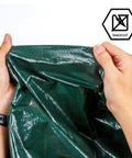 Holding 8x10 Feet Waterproof Green Tarp 8 Mil Thick Multipurpose Protective Cover, showcasing tearproof, durable material
