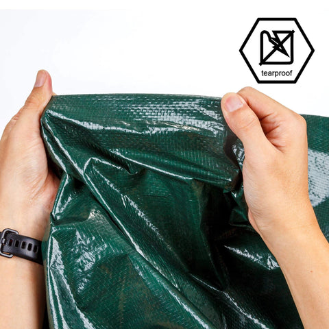 Holding 8x10 Feet Waterproof Green Tarp 8 Mil Thick Multipurpose Protective Cover, showcasing tearproof, durable material
