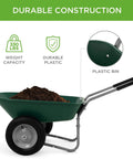 Dual Wheel Home Utility Yard Wheelbarrow Garden Cart with Built In Stand 5 Cubic Foot Capacity 330 lb Load Green with dirt in bin
