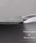 Side view of grey Baby Door Latch Cover Silencer for Nurseries, thick cushion and soft three-layer fabric with elastic straps.