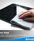 Hand using grey microfiber cleaning cloth to wipe tablet, focus on Microfiber Cleaning Cloths 100 Sheets 11x9 Grey Lint Free For Garage Auto Care