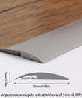 Close-up of grey Trimold Carpet to Tile Floor Transition Strip, showing thickness and 3m length, installed on wood flooring and carpet