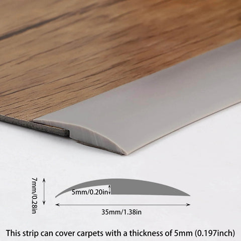Close-up of grey Trimold Carpet to Tile Floor Transition Strip, showing thickness and 3m length, installed on wood flooring and carpet