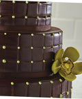 Close-up of chocolate cake with grid pattern and flower, made using 8 Piece Flexible Silicone Cake Mold Set With Grid Pattern For Fondant Impressions