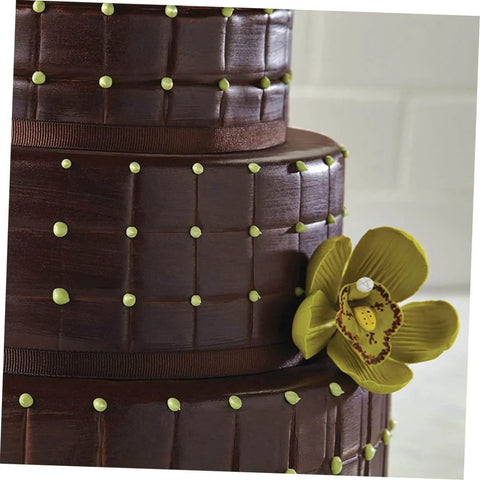 Close-up of chocolate cake with grid pattern and flower, made using 8 Piece Flexible Silicone Cake Mold Set With Grid Pattern For Fondant Impressions