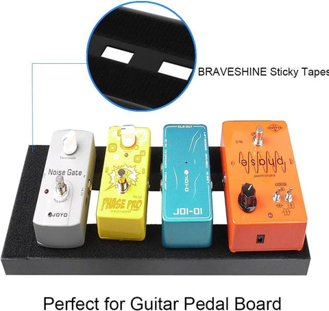 Guitar pedal board with noise gate, phase pro, blue effect, and orange phaser pedals secured by heavy-duty hook and loop strips.