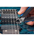 Cutting guitar strings with All-In-One Guitar String Changing Kit With Winder, Cutter, Puller And 10mm Wrench on electric guitar.