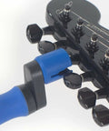 All-In-One Guitar String Changing Kit With Winder, Cutter, Puller And 10mm Wrench, Silent, Scratch-Free Rubber Lined Grip shown on guitar headstock.