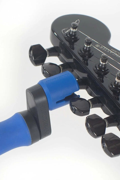 All-In-One Guitar String Changing Kit With Winder, Cutter, Puller And 10mm Wrench, Silent, Scratch-Free Rubber Lined Grip shown on guitar headstock.