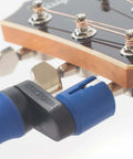 All-In-One Guitar String Changing Kit with winder adjusting guitar strings, silent, scratch-free grip for quick string changes.