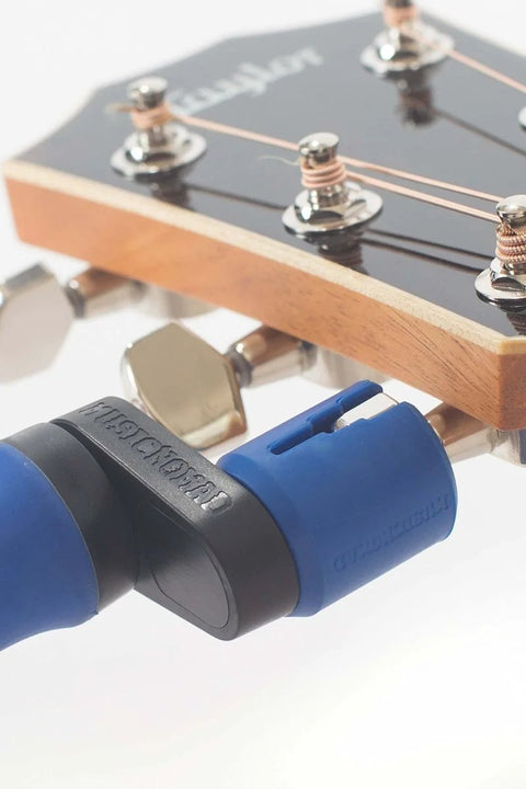 All-In-One Guitar String Changing Kit with winder adjusting guitar strings, silent, scratch-free grip for quick string changes.