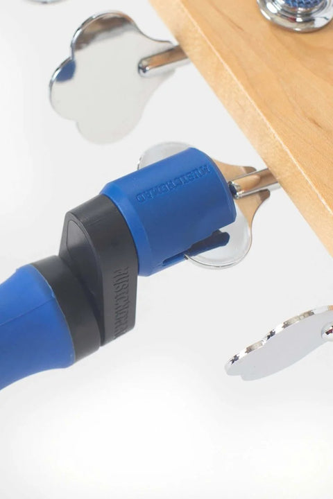 All-In-One Guitar String Changing Kit with winder in use on guitar tuning peg, blue grip, silent, scratch-free rubber lined grip
