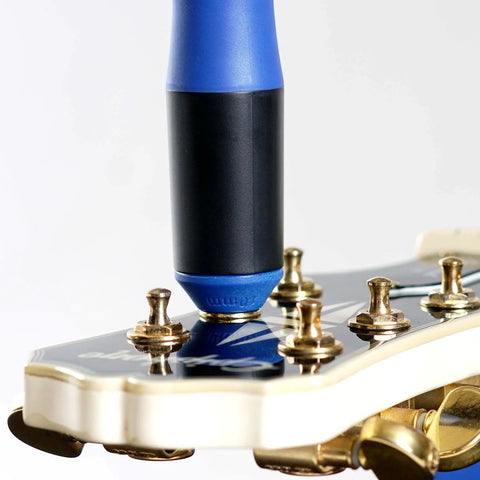 All-In-One Guitar String Changing Kit With Winder, Cutter, Puller And 10mm Wrench tool in use on guitar headstock
